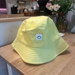 Yellow smiley face bucket beach hat